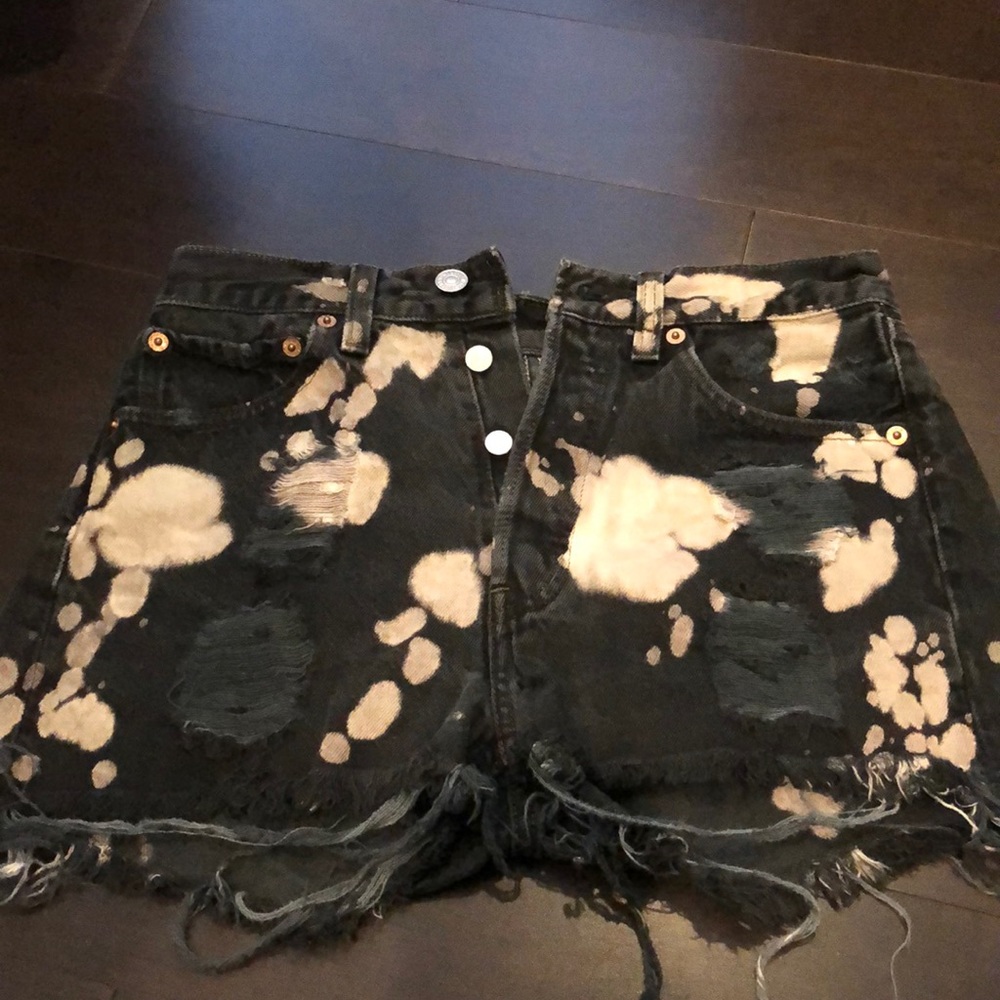 High waisted jean shorts with splatter.